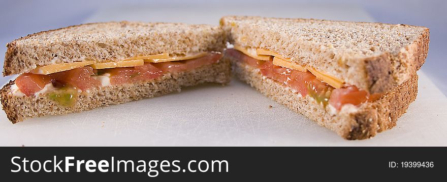 Tomato sandwich with cheese on whole wheat bread