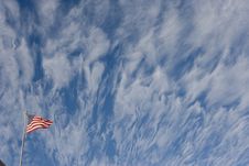 Torn Flag With Clouds Stock Photos