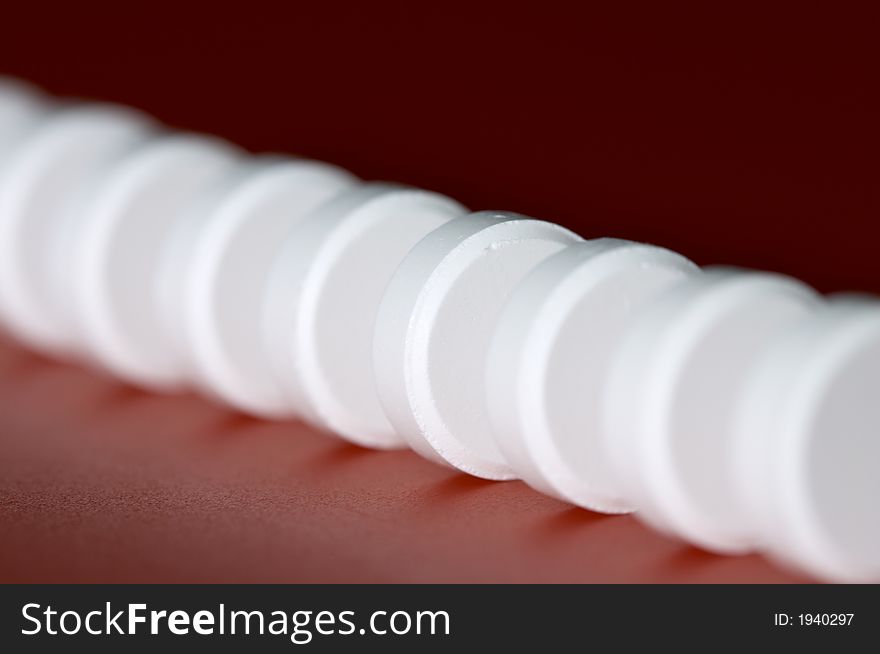 Macro of column of white tablet. Shallow DOF. Macro of column of white tablet. Shallow DOF