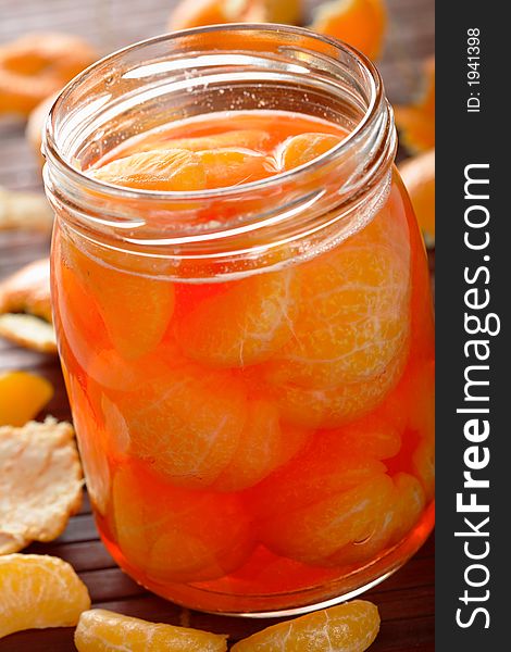 Tangerines with alcohol liqueur in the jar. Tangerines with alcohol liqueur in the jar