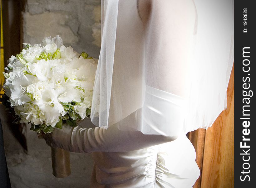 Flowers held in the hands of a bride.