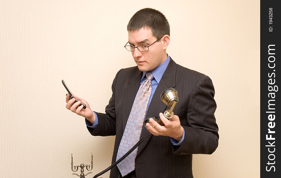 Business Man With Two Phones