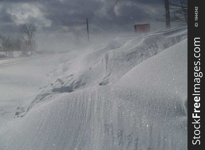 Snow blown by the wind to form a drift. Snow blown by the wind to form a drift.