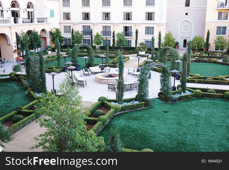 A green relaxing area of a building complex. A green relaxing area of a building complex