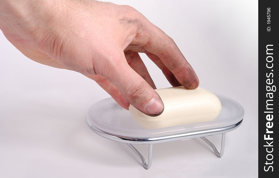 Male filthy hand with bar of soap and soap dish. Male filthy hand with bar of soap and soap dish