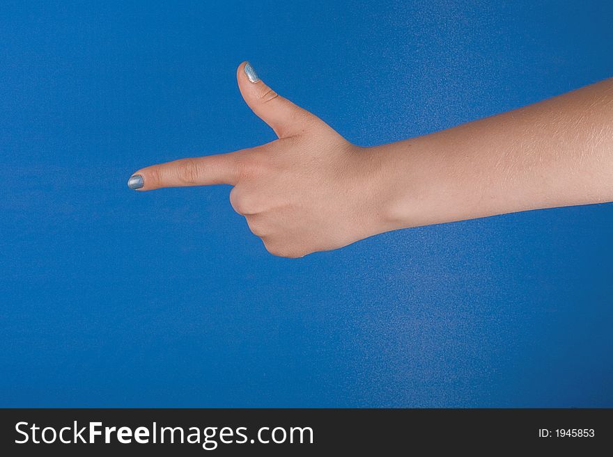 Figure of fingers with blue nacre manicure against blue background. Figure of fingers with blue nacre manicure against blue background