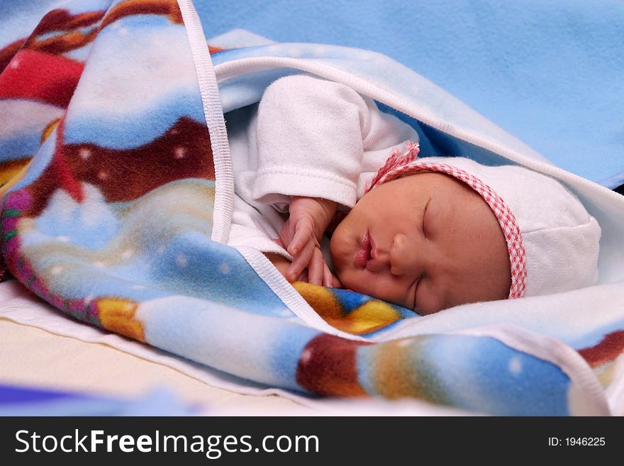 Small new born boy sleeping in the bed. Small new born boy sleeping in the bed