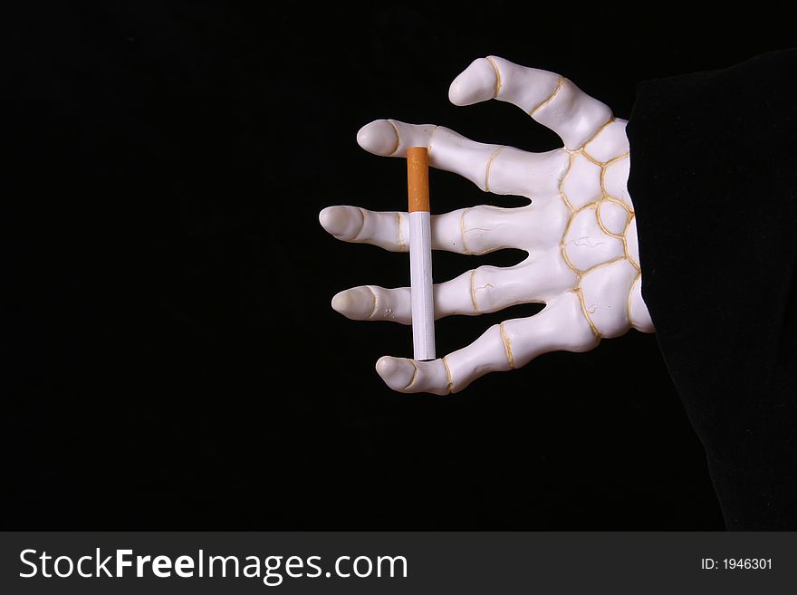 Cloaked hand of death holding a cigarette. Cloaked hand of death holding a cigarette.