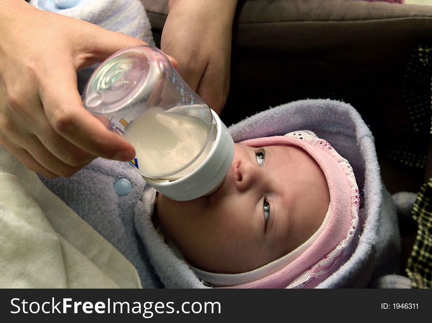 New born baby boy eating his milk. New born baby boy eating his milk