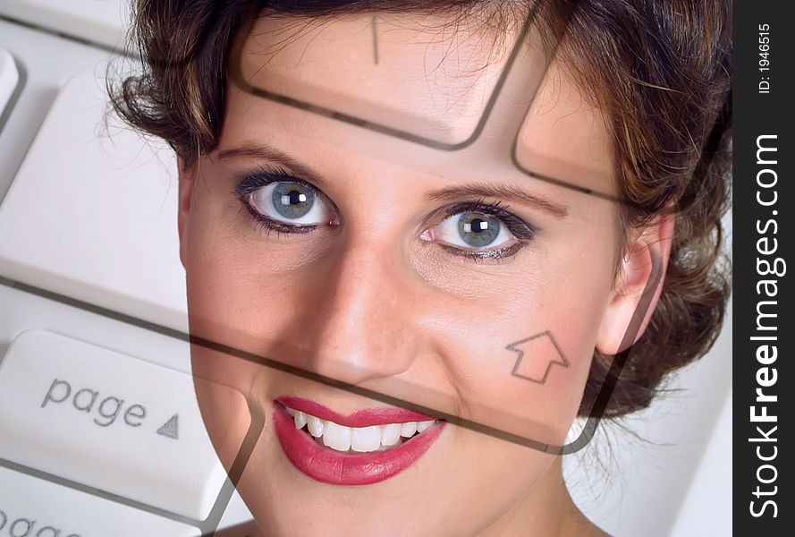 Young womans face overlaid on to computer laptop keyboard. Young womans face overlaid on to computer laptop keyboard