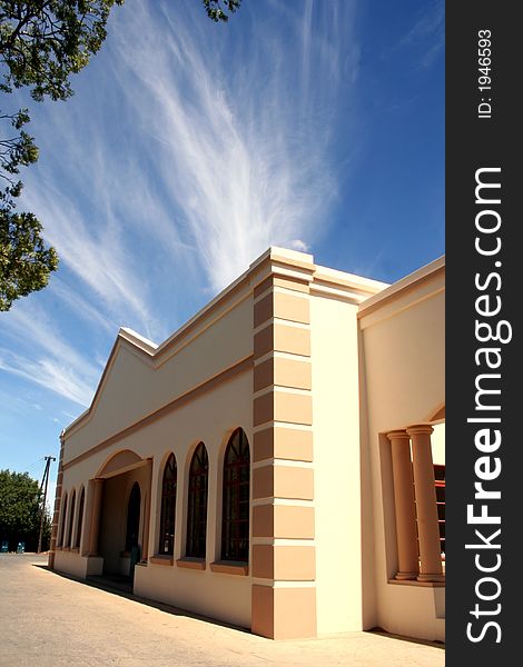 Building with blue sky and white clouds