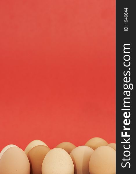 Brown eggs on red background. Brown eggs on red background