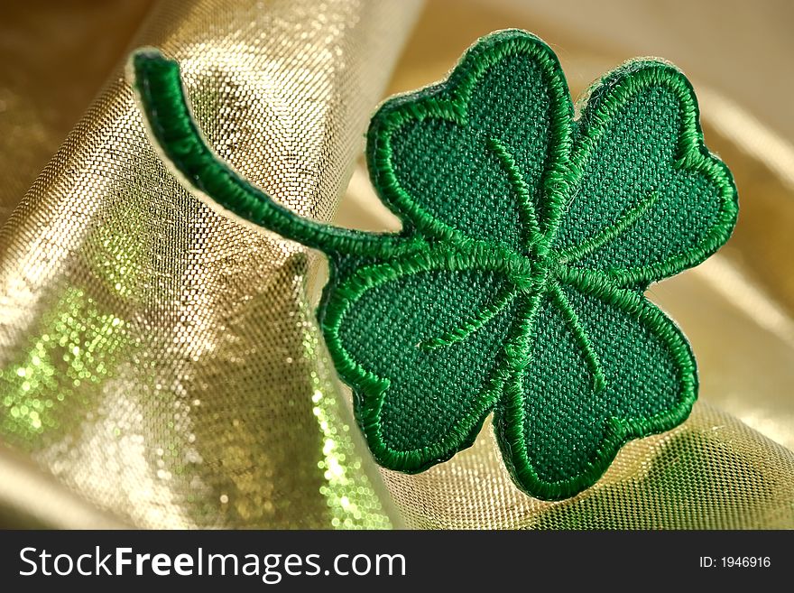 Four leaf clover and shine of gold