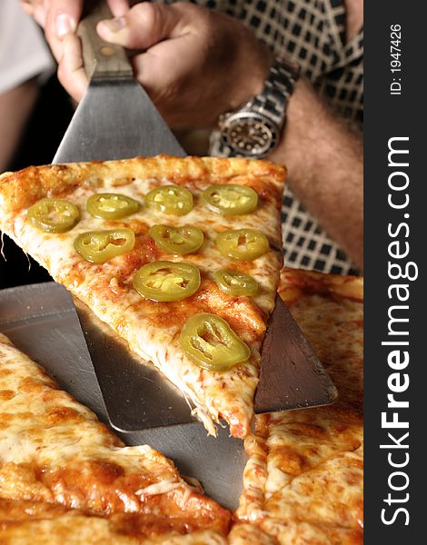 Closeup of a Pepper Pizza slice at an Angle, Closeup. Closeup of a Pepper Pizza slice at an Angle, Closeup