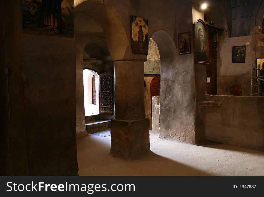 Light going through the door of an old church in one of the coptic orthodox monasteries located within the deserts of Egypt. Light going through the door of an old church in one of the coptic orthodox monasteries located within the deserts of Egypt.