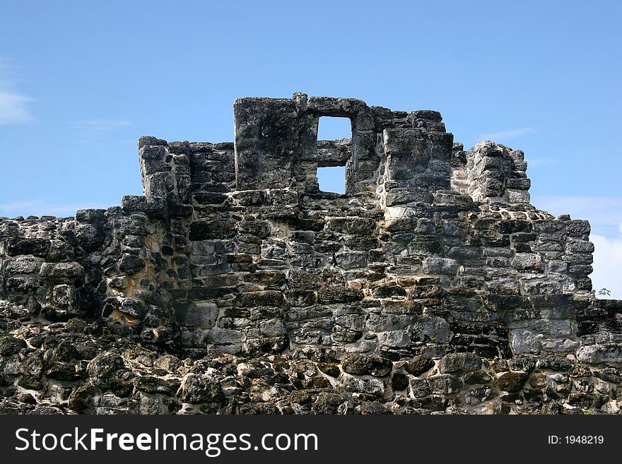 An ancient crumbling mayan monument. An ancient crumbling mayan monument