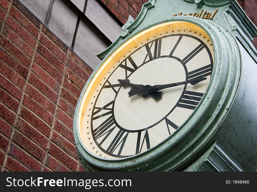 Green Street Clock with Roman Numberal Numbers