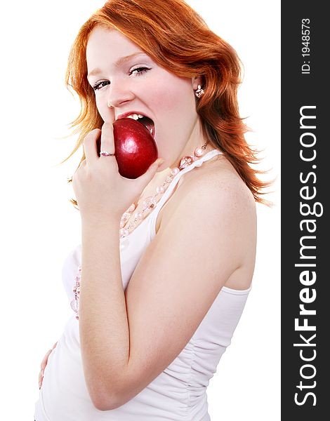 Young beautiful sexy red smiling woman with apple on the white background. Young beautiful sexy red smiling woman with apple on the white background