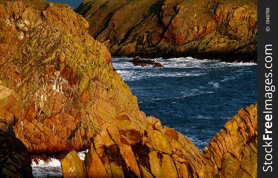 North sea and  multicolored cliff. North sea and  multicolored cliff