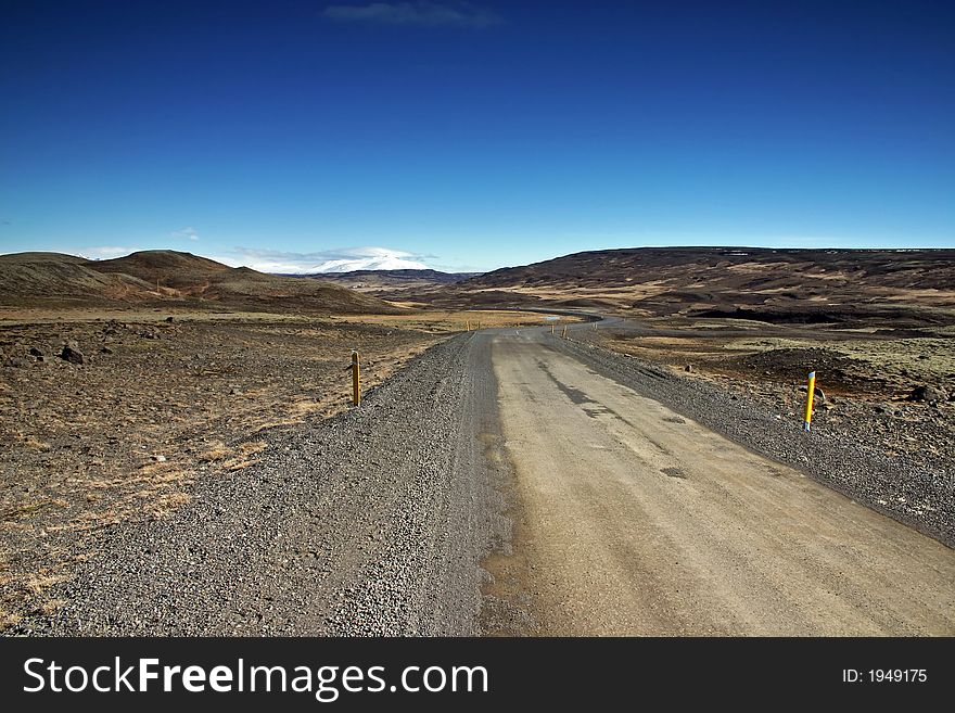 Icelandic landscape with road and blue sky