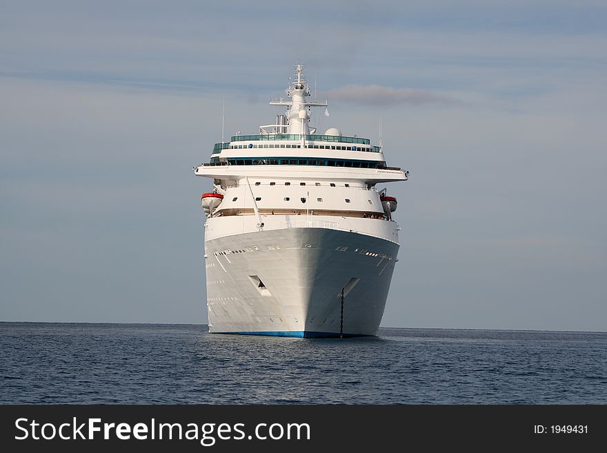 Large luxury cruise ship anchored in the ocean. Large luxury cruise ship anchored in the ocean.