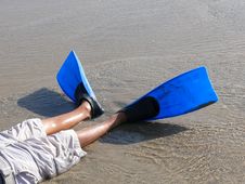Boy S Legs Wearing Swim Fins On The Beach Royalty Free Stock Photography