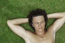 The Man Lies On A Green Grass Stock Photography The Man Lies On A Green Grass Stock Photography