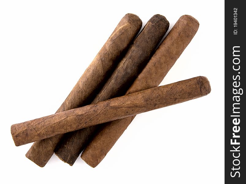 Four cigars on a white background.