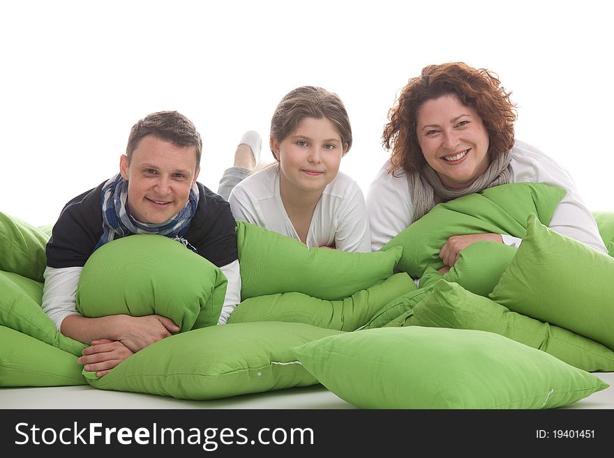 Family of three lying side by side on pillows. Family of three lying side by side on pillows
