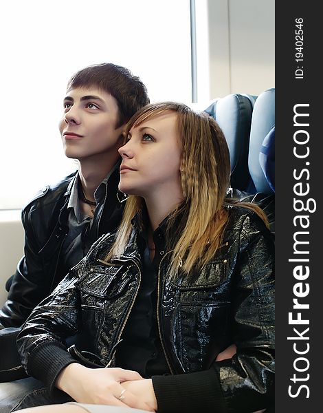 Young couple travelling by train. Young couple travelling by train.