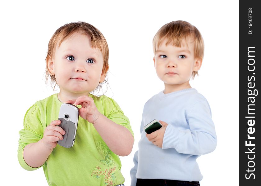 Isolated surprised little girl and boy the phone