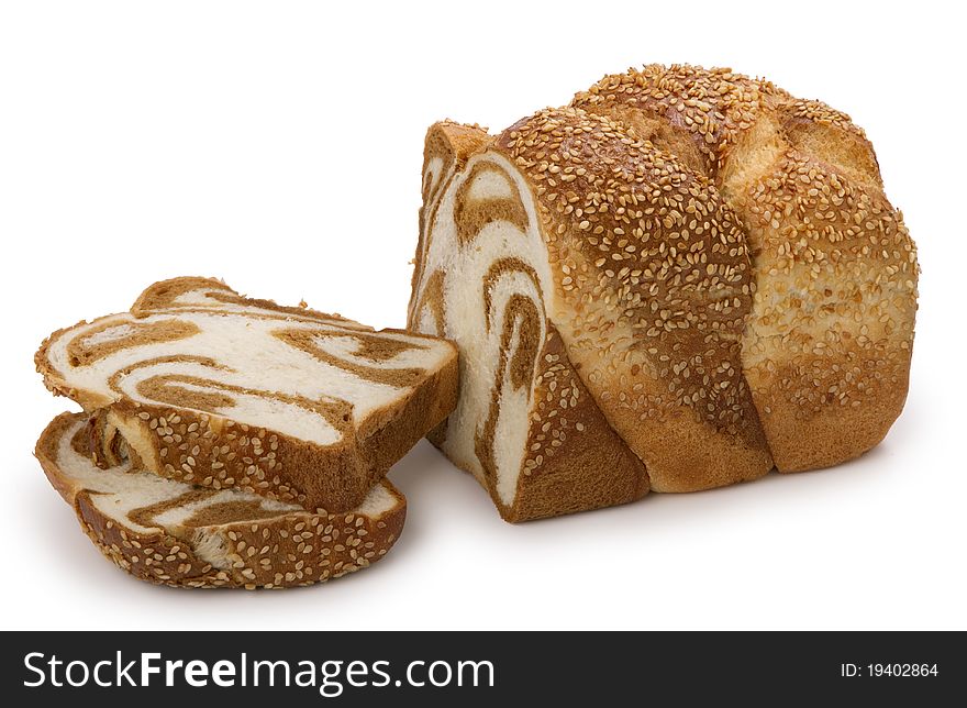 Loaf of fresh marble wheat bread, whole and sliced, isolated on white background. Loaf of fresh marble wheat bread, whole and sliced, isolated on white background.