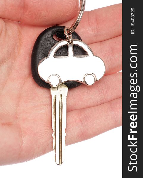 Hand holding new car key and keyring. Hand holding new car key and keyring