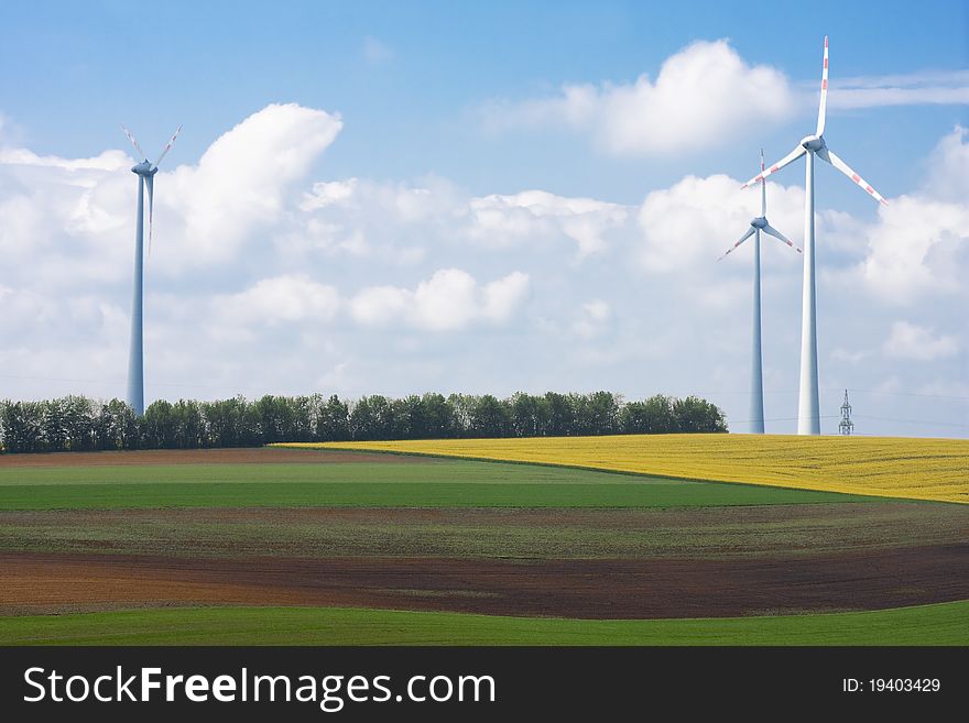 Spring landscape with wind turbine towers. Spring landscape with wind turbine towers.