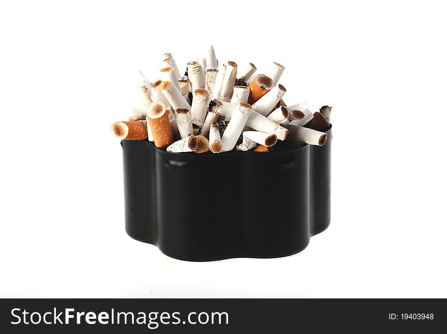 Ashtray with cigarette stubs on a white background