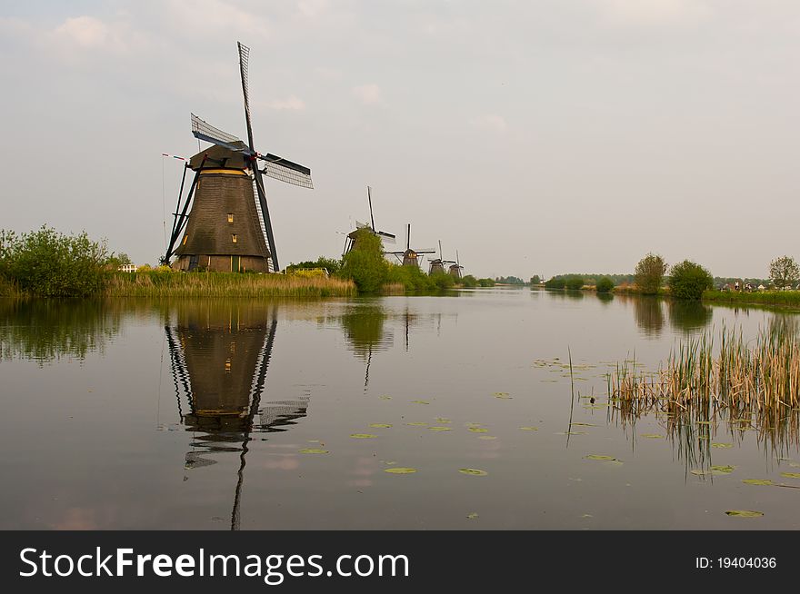 Windmills in the evening sunset after the rain. Windmills in the evening sunset after the rain.