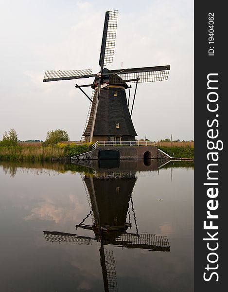 A windmills in the evening sunset after the rain. A windmills in the evening sunset after the rain.