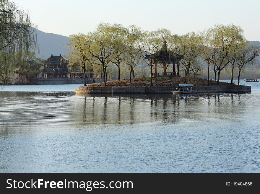 This picutre was taken in summer palace. the pivilion sites in the south of the park. this picture was taken in spring.the trees grow green and the sky is blue. This picutre was taken in summer palace. the pivilion sites in the south of the park. this picture was taken in spring.the trees grow green and the sky is blue.