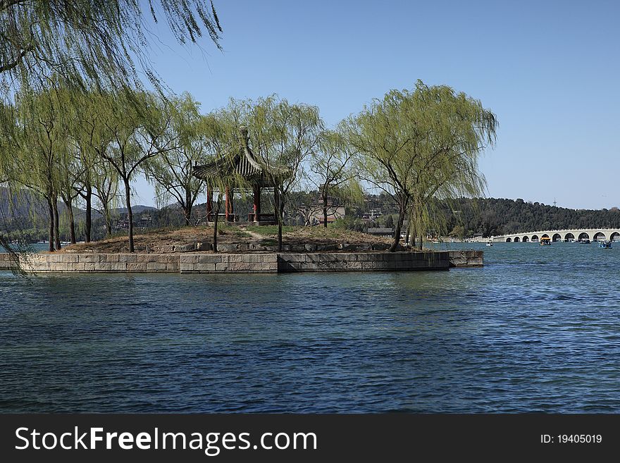 This picutre was taken in summer palace. the pivilion sites in the south of the park. this picture was taken in spring.the trees grow green and the sky is blue. This picutre was taken in summer palace. the pivilion sites in the south of the park. this picture was taken in spring.the trees grow green and the sky is blue.