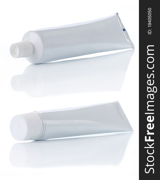 Blank plastic product. tooth paste over white background