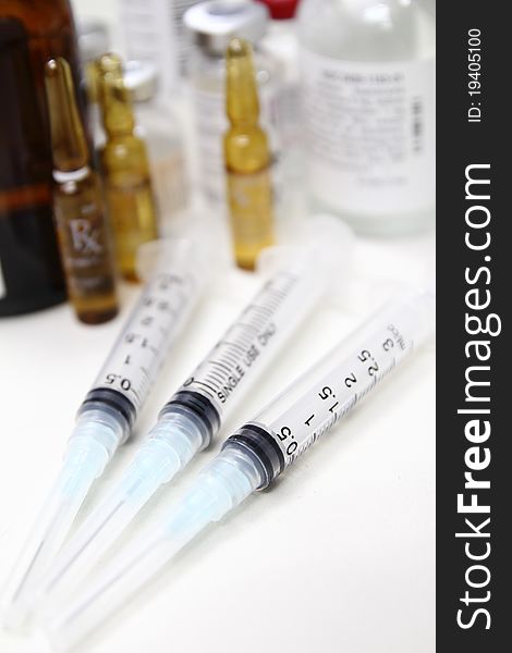 Disposable syringes with vials of medicines in narrow DOF. Disposable syringes with vials of medicines in narrow DOF