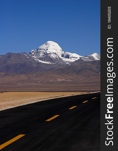 Landscape of snow-capped mountains and a highway road in the highlands of Tibet. Landscape of snow-capped mountains and a highway road in the highlands of Tibet