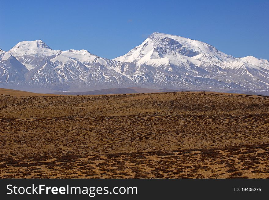 Landscape of snow-capped mountains in the highlands of Tibet