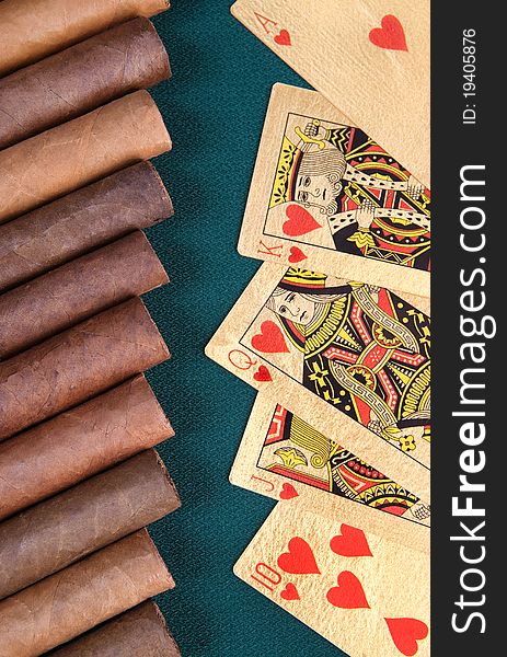 Cigars and playing cards.