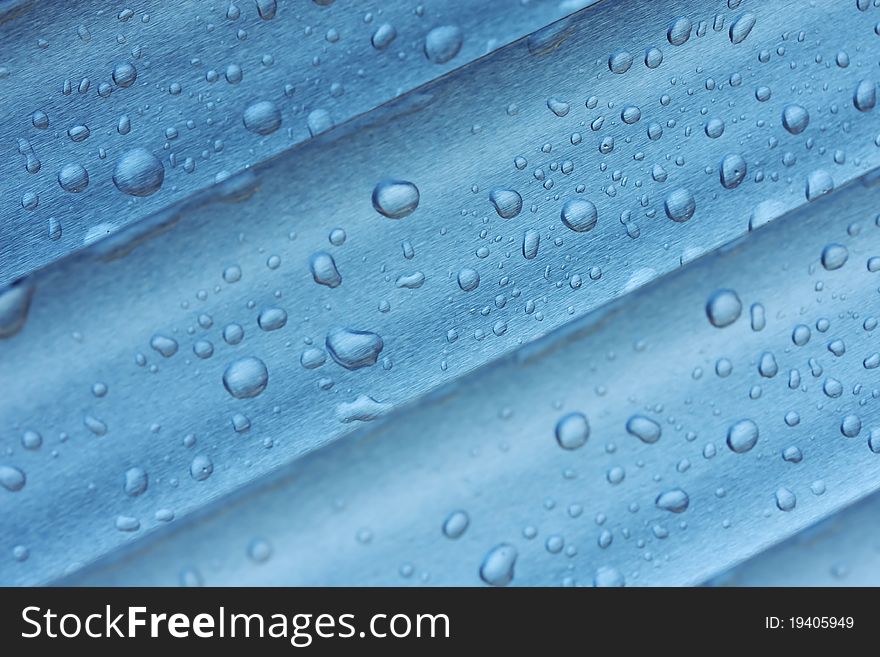 Abstract composition of water-drops over metal surface. Abstract composition of water-drops over metal surface