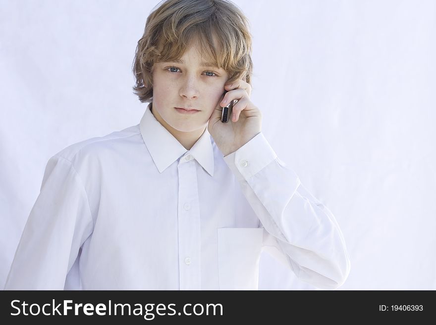 A young man talking on mobile phone. A young man talking on mobile phone