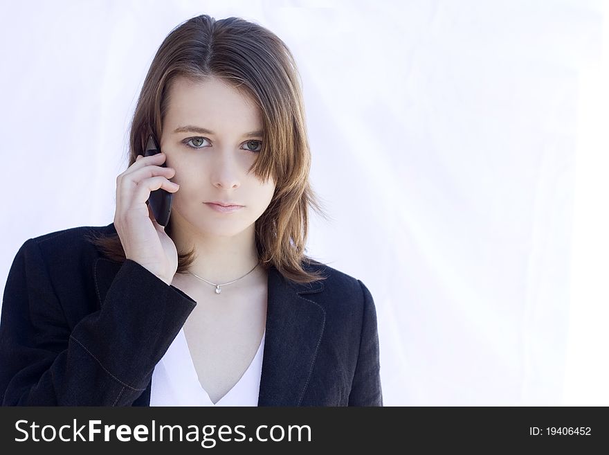 Portrait of young woman talking on the mobile phone