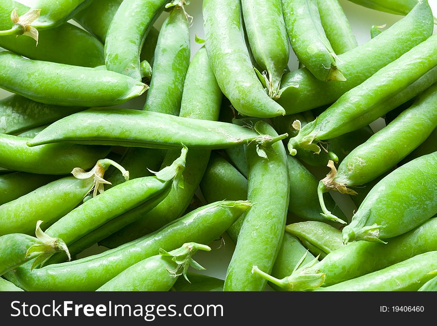 A lot of fresh green peas close up