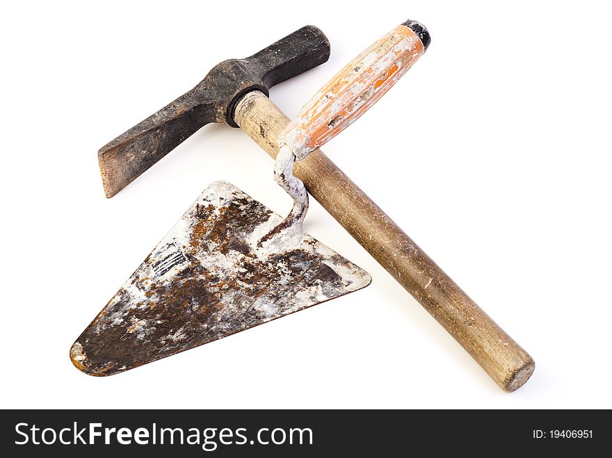 Hammer and trowel on white background