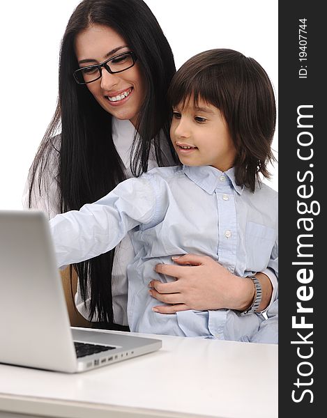 Happy mother and son on laptop at the table